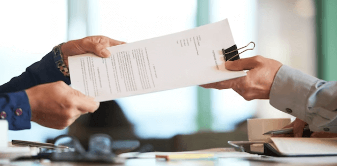 A professional translator submitting a certified document after review at our translation services in Des Moines.